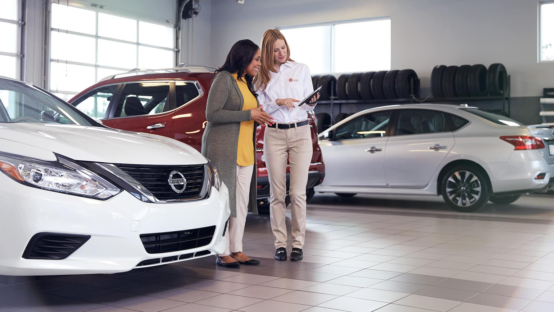 Boch Nissan South is a Family Owned Dealership near Pawtucket, RI | Customer meeting with Nissan Service Advisor