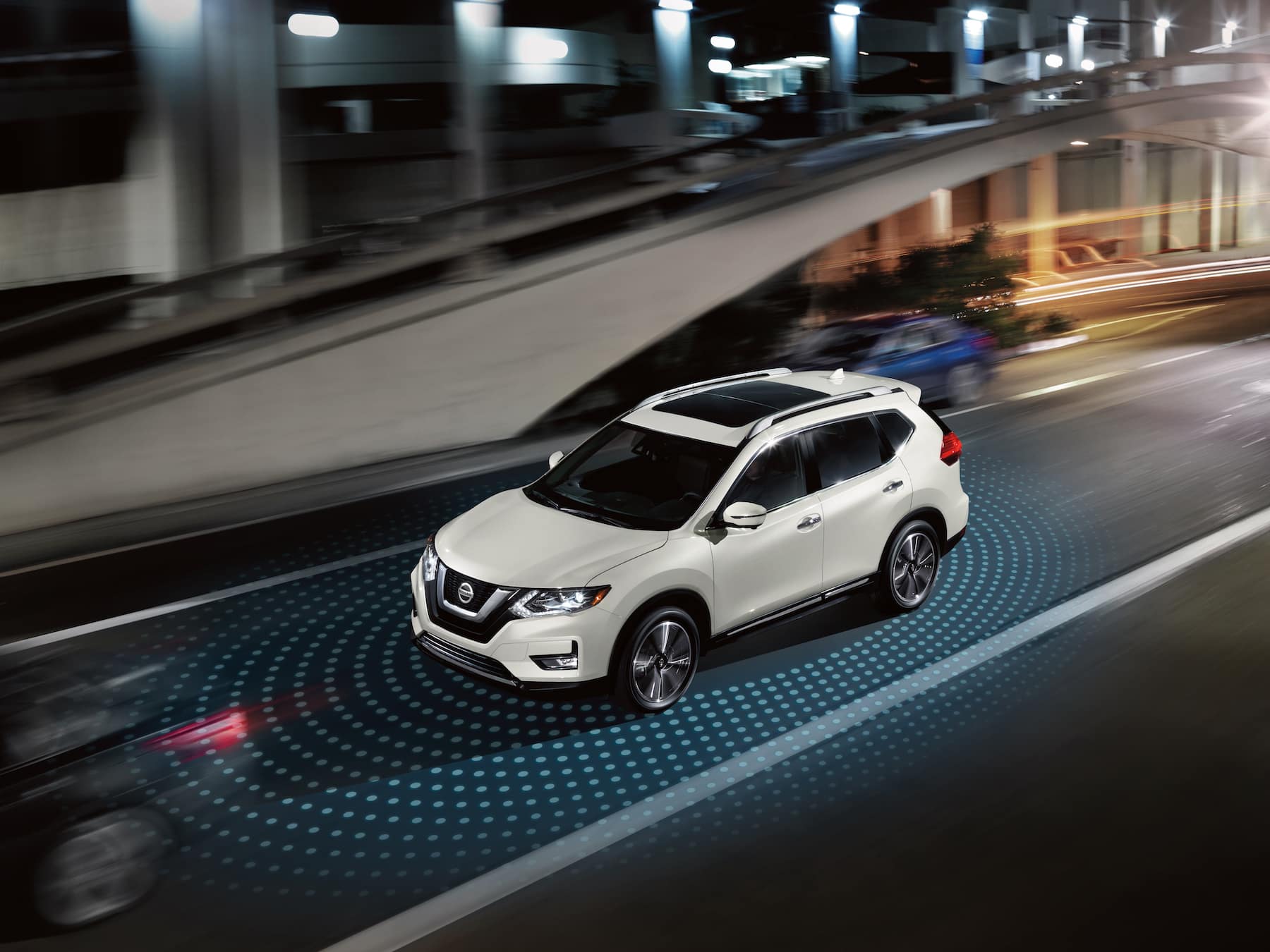 Boch Nissan South is a Family Owned Dealership near Norton, MA | Visualization of 2020 Nissan Rogue using blindspot monitors on highway at night