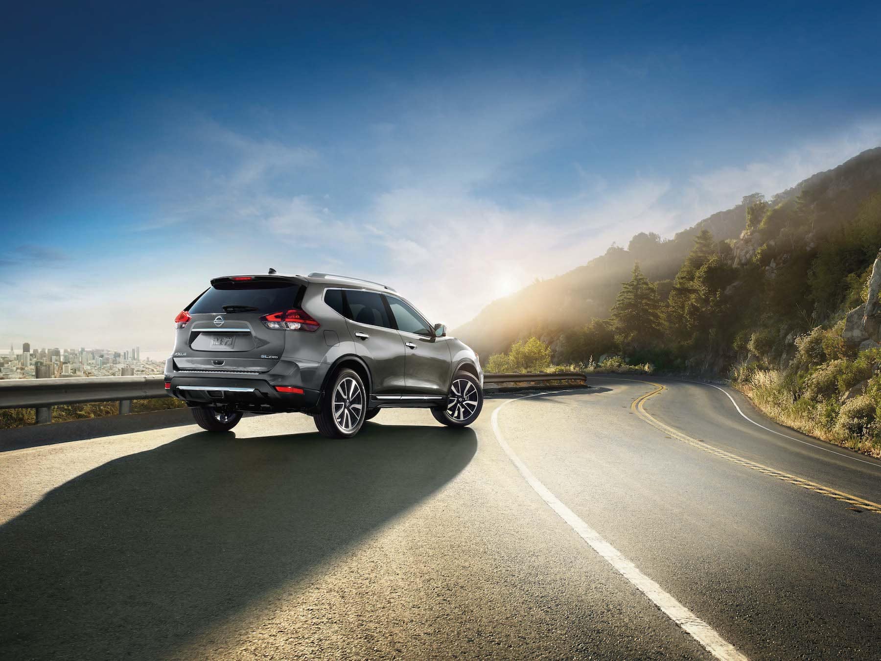 Boch Nissan South is a Family Owned Dealership near Pawtucket, RI | Silver Nissan Rogue Sport parked on mountain road