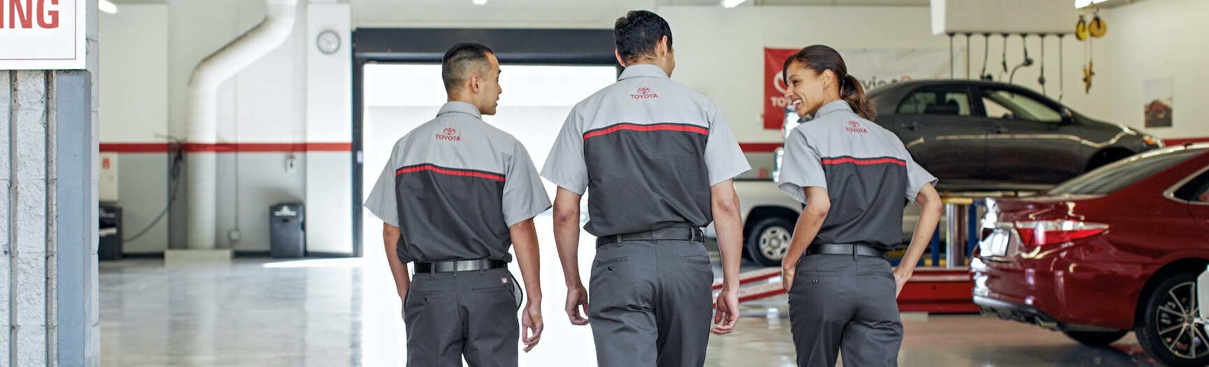 Boch Toyota is a Family Owned Dealership near Dover, MA | Toyota service technicians talking in service center