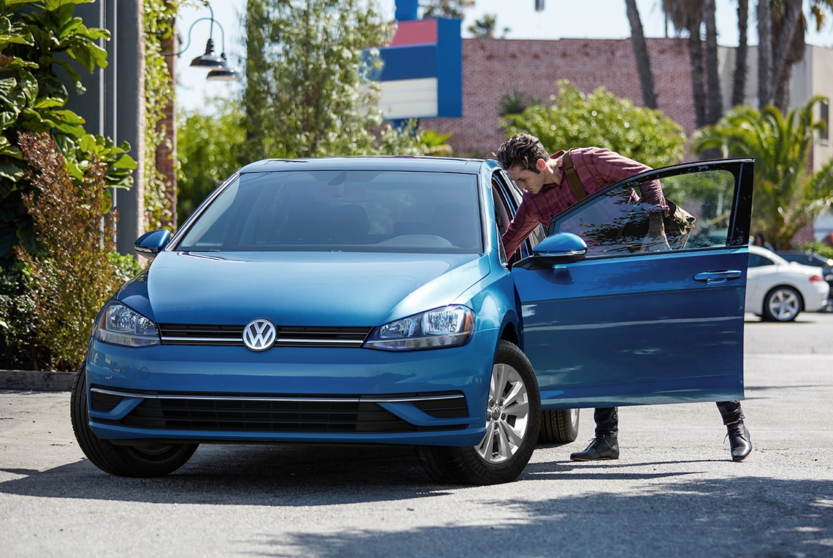 Blue 2020 Volkswagen Golf with Drivers door open