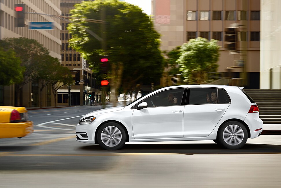 2020 Volkswagen Golf driving through intersection