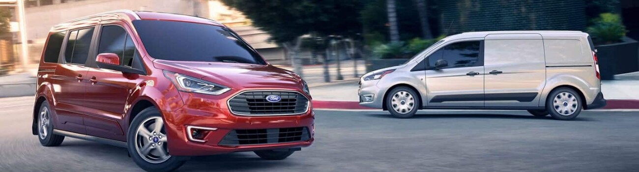 2019 Ford Transit Ford commercial vans Bowen Scarff Ford Kent, WA.png Exterior view of 2 Ford transit passenger cargo vans crossing each others path in a downtown scene