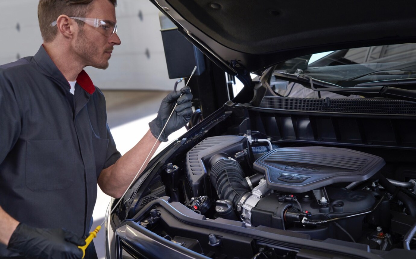 Service worker checking oil