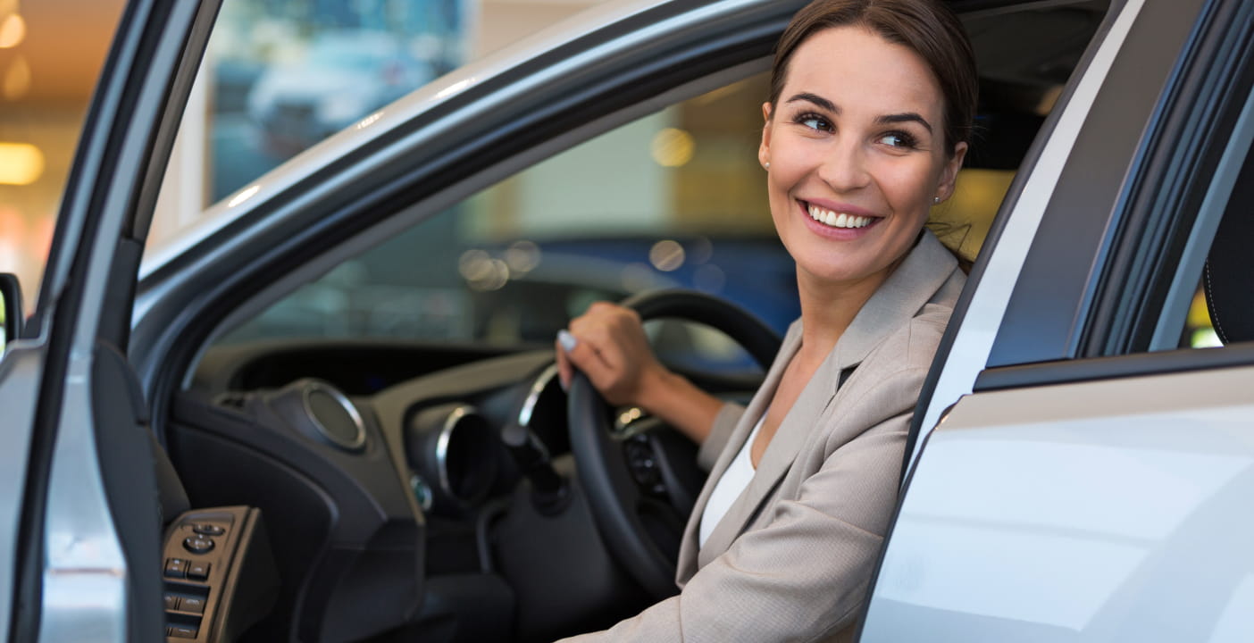 A customer explores Genesis vehicles near South Miami, FL.