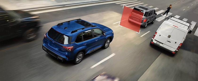 Blue 2026 Subaru Forester Hybrid on a street with a hazard highlighted ahead, demonstrating pre-collision braking