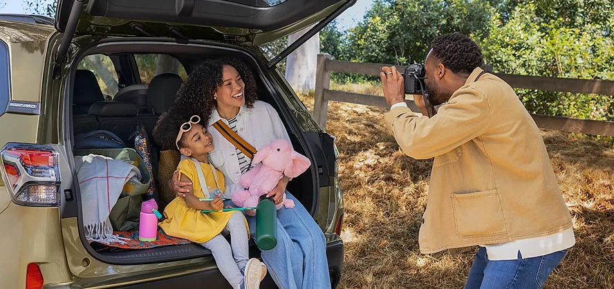 Open rear cargo area of the 2026 Subaru Forester Hybrid with the rear gate raised