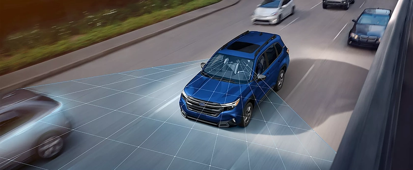Overhead view of a blue 2026 Subaru Forester Hybrid on a highway with the EyeSight detection zone highlighted