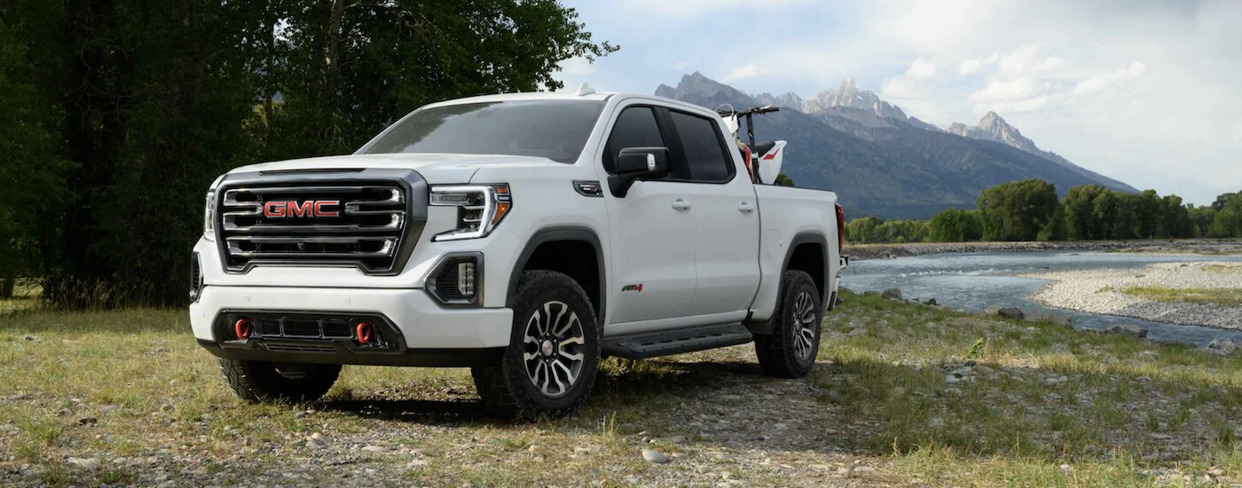 2021%20GMC%20Sierra%201500%20-%20Truck%20white.png White 2021 GMC Sierra 1500 parked by a lake