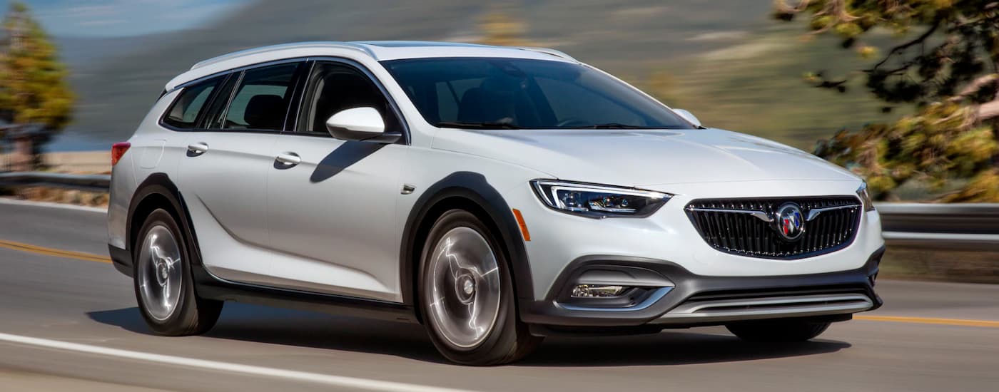 2020%20Buick%20Regal%20TourX%20-%20White.jpg White 2020 Buick Regal TourX driving down the street