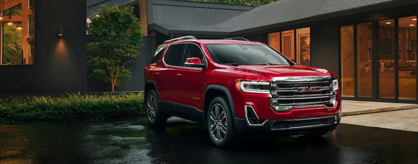 A red 2023 GMC Acadia from the front after leaving a dealer that has a used GMC for sale near Pembroke Pines.