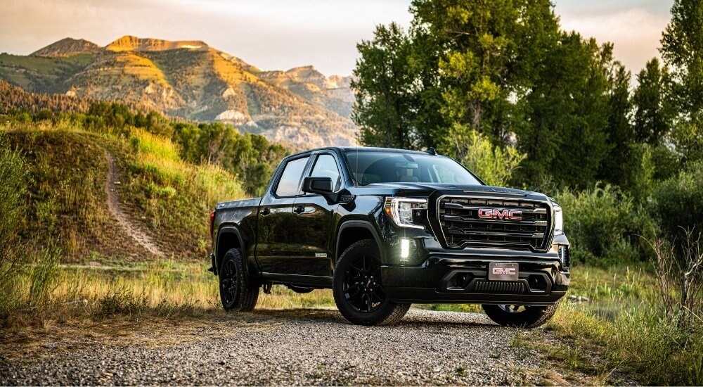 A black 2023 GMC Sierra 1500 from the front at an angle.