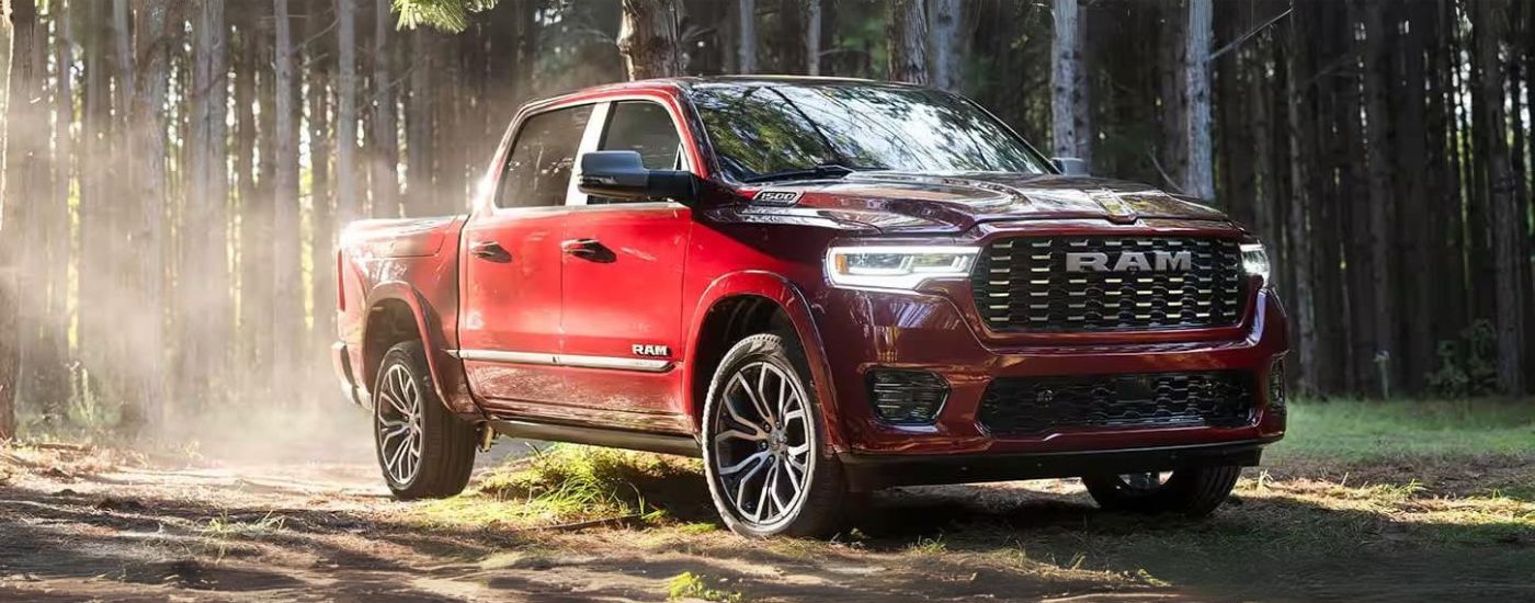 A red 2025 Ram 1500 parked off-road A red 2025 Ram 1500 parked off-road
