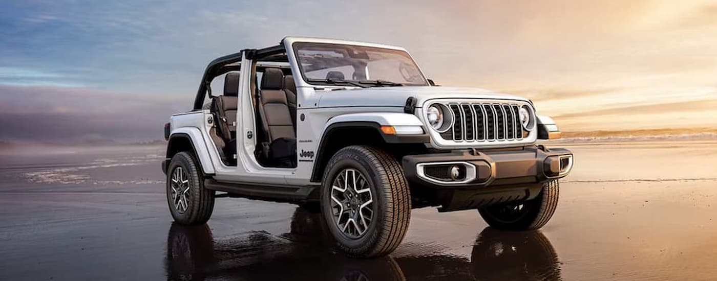 wlp%20-%202025%20Jeep%20Wrangler%20Jeep%20Dealer%20Near%20Miami%20Beach%20-%20White.jpg A white 2025 Jeep Wrangler parked on a beach