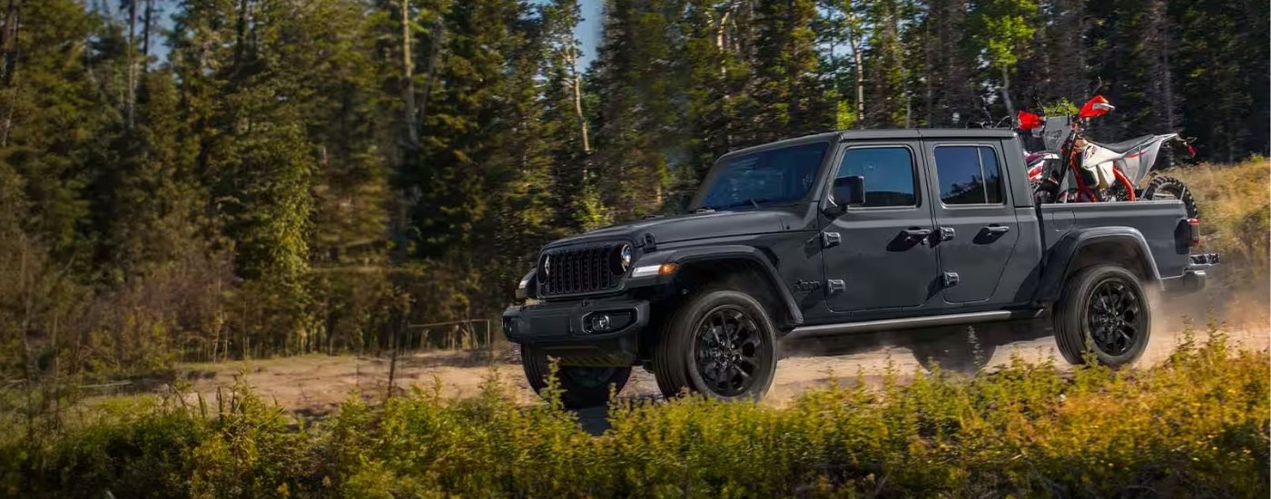 2025 Jeep Gladiator Nighthawk - Dirtbike.jpg Black 2025 Jeep Gladiator Nighthawk hauling a dirt bike