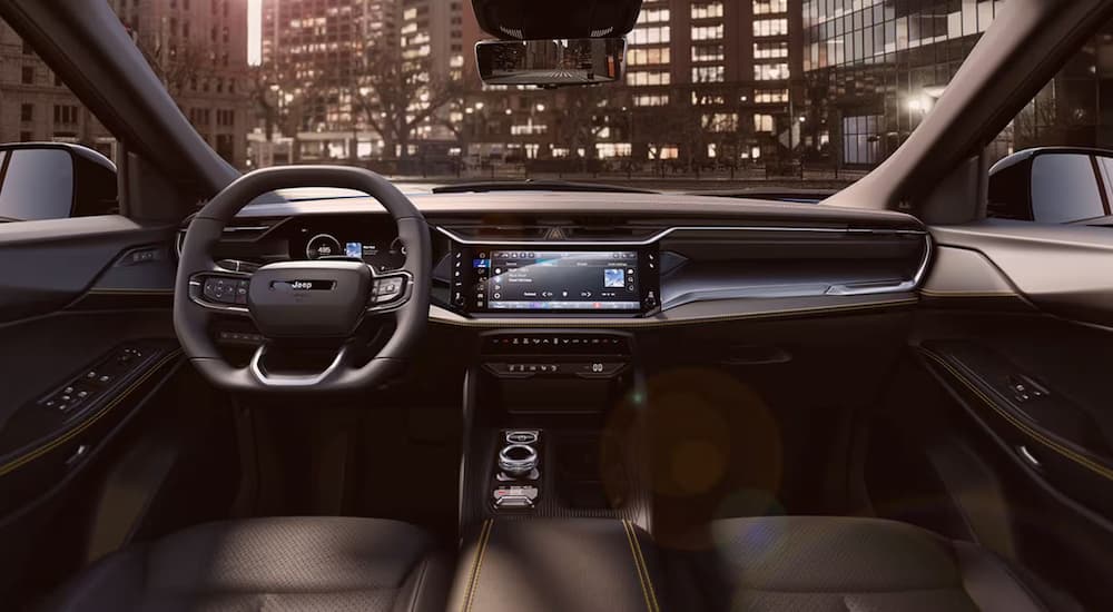 2026%20Jeep%20Cherokee%20Hybrid%20-%20Tech.jpg Infotainment display and digital gauge cluster in a 2026 Jeep Cherokee Hybrid
