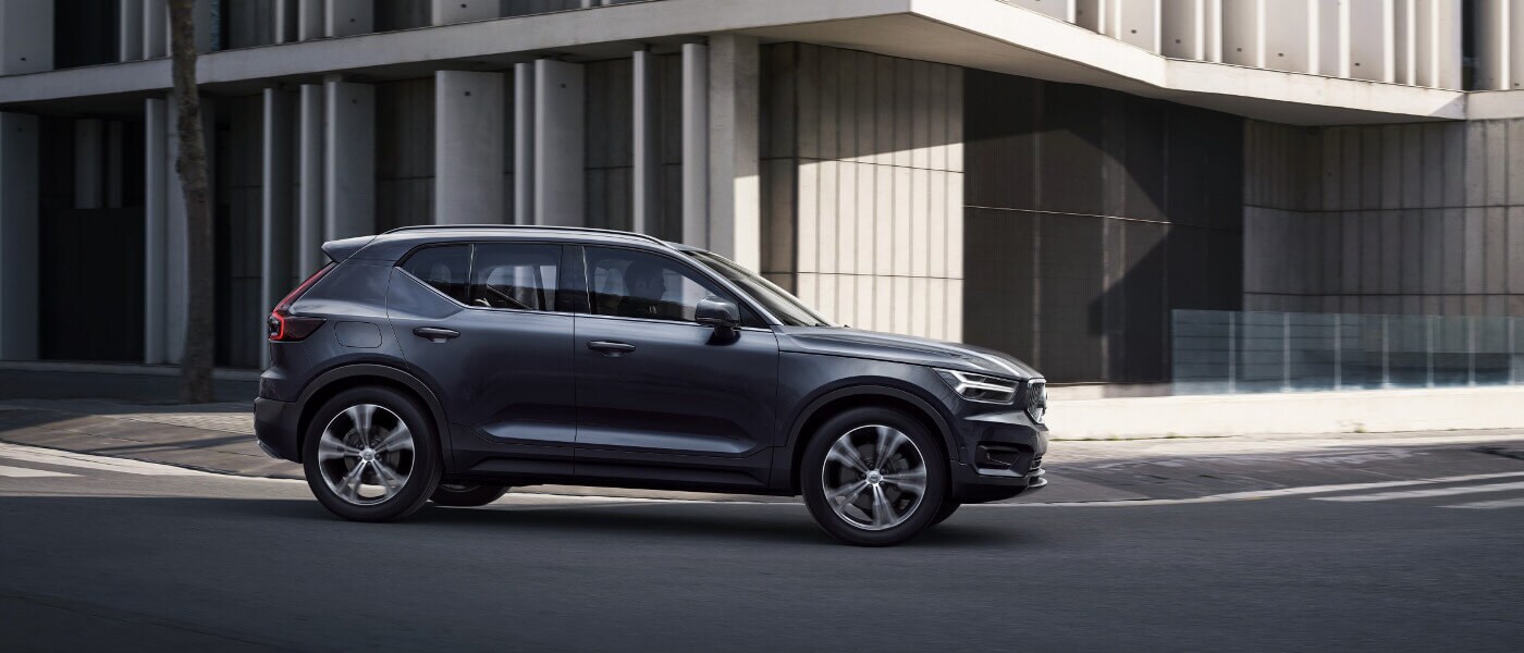 New Volvo XC40 driving through a city exterior view