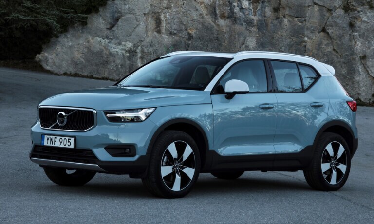 New Volvo XC40 parked by a rock