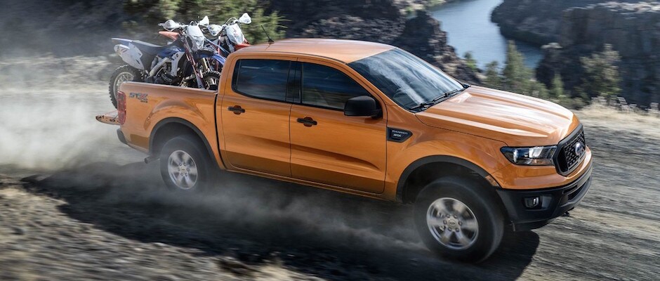 2019 Ford Ranger Power An orange 2019 Ford Ranger carrying two motorcycles