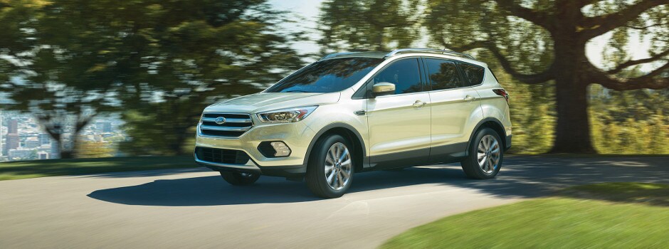 Test drive a Ford at Bull Valley Ford Today! Ford SUV driving down the road