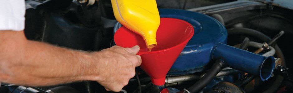 Ford Services in McHenry County A maintenance professional performing an oil change