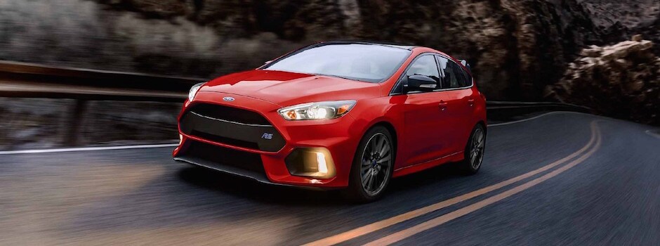 2018 Ford Focus Review A red 2018 Ford Focus driving through a canyon