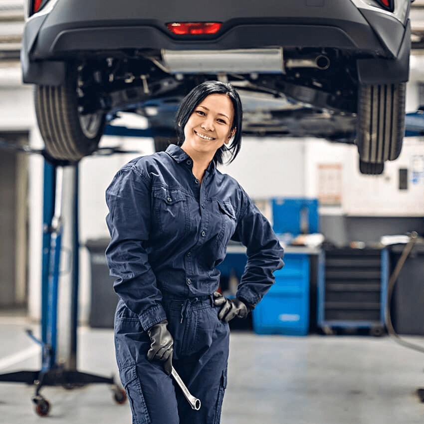 Woman Mechanic in Front of Car
