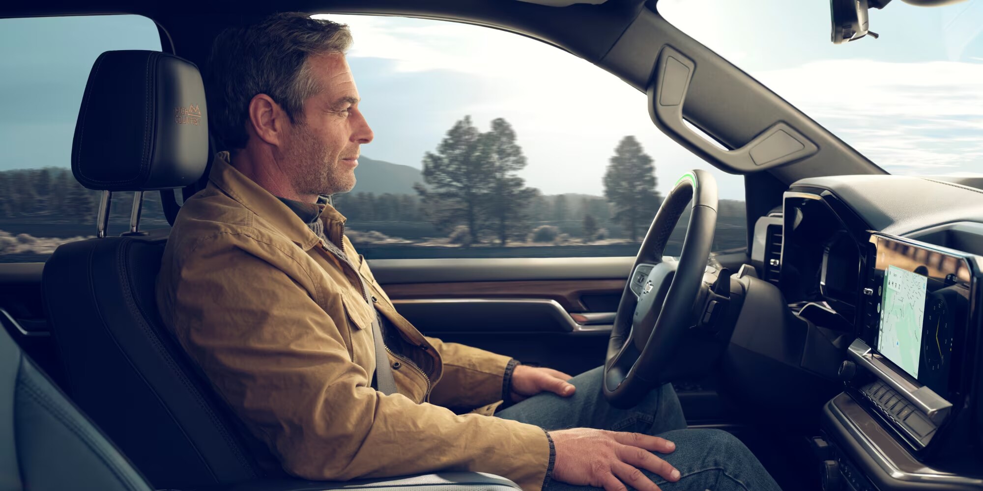 Man sitting in a new Chevy Silverado 1500 Man sitting in a new Chevy Silverado 1500
