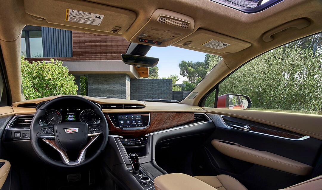 view of the central dashboard, steering wheel and main console inside of the 2022 Cadillac XT6