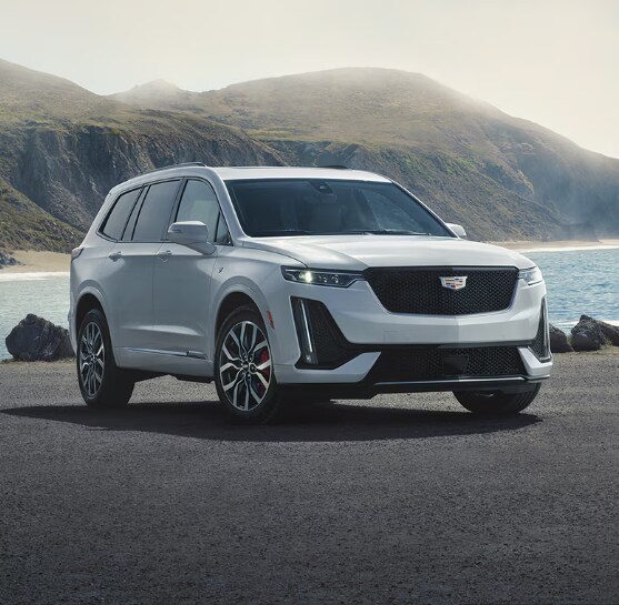 The 2024 Cadillac XT6 on a rocky beach The 2024 Cadillac XT6 on a rocky beach