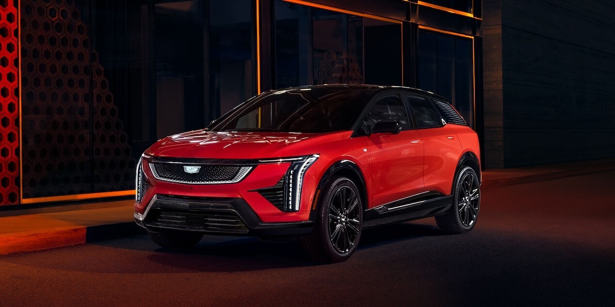 2025 Cadillac OPTIQ parked on a lit street at night 2025 Cadillac OPTIQ parked on a lit street at night