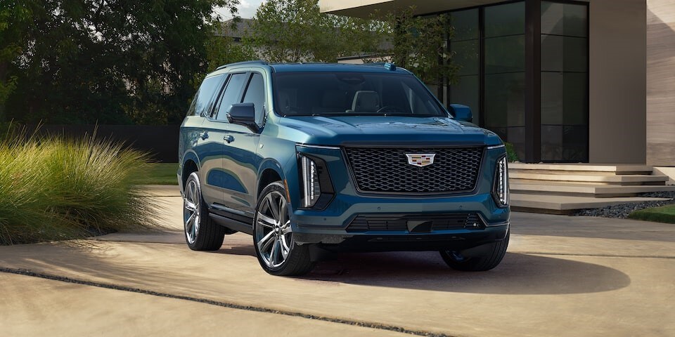 2025 Cadillac Escalade parked beside a house 2025 Cadillac Escalade parked beside a house