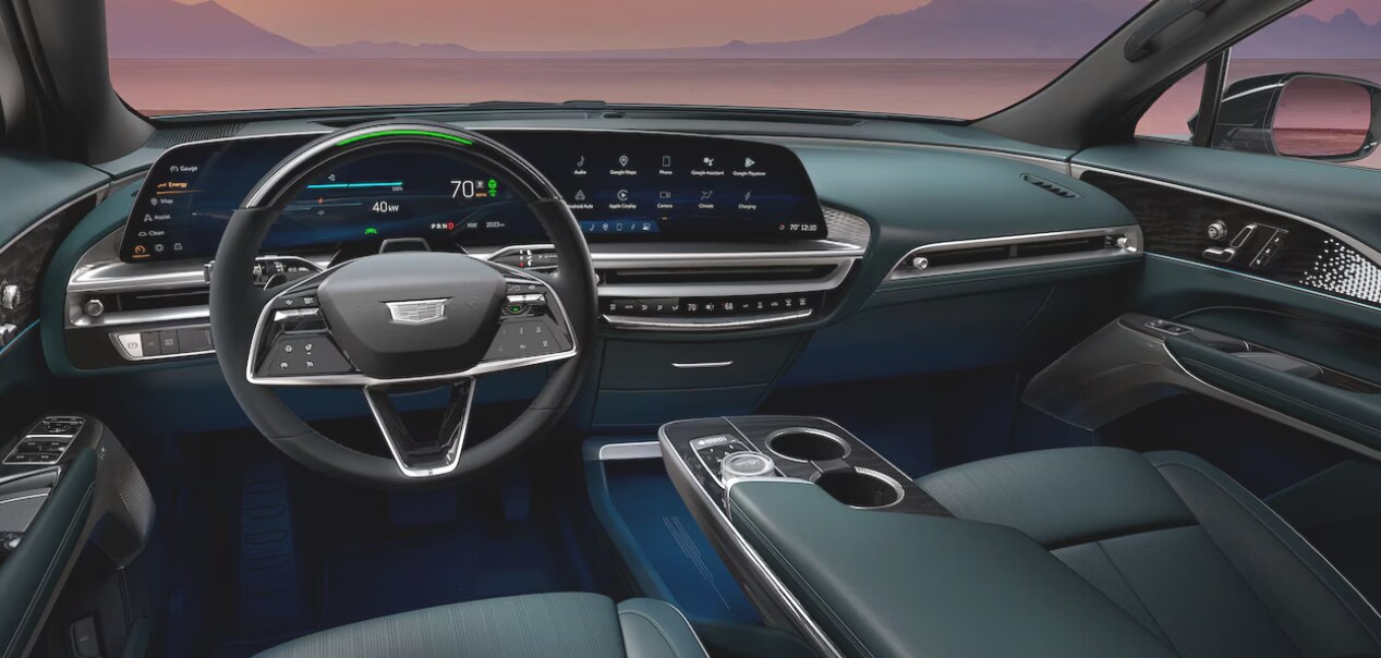 The dashboard of the 2024 Cadillac LYRIQ with a purple sunset beyond the windshield The dashboard of the 2024 Cadillac LYRIQ with a purple sunset beyond the windshield