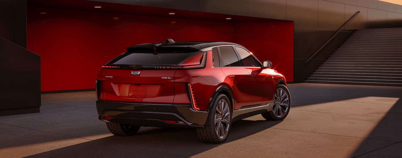 A red 2024 Cadillac Lyriq is shown from the rear at an angle.