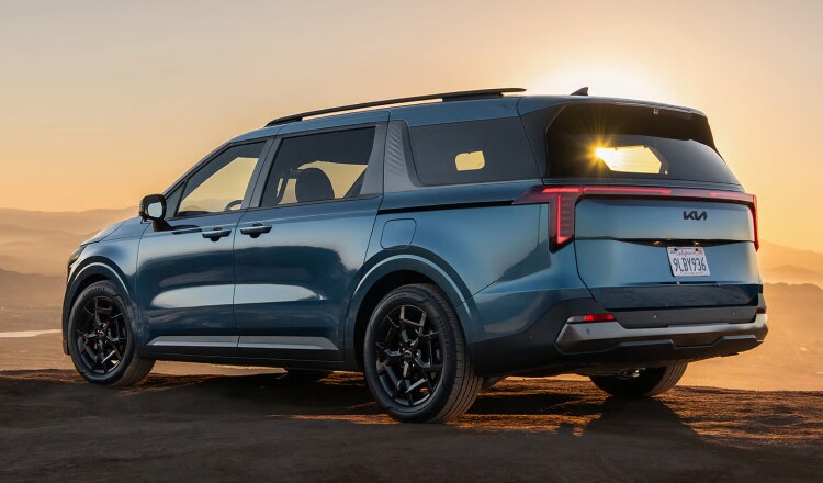 Blue Kia Minivan