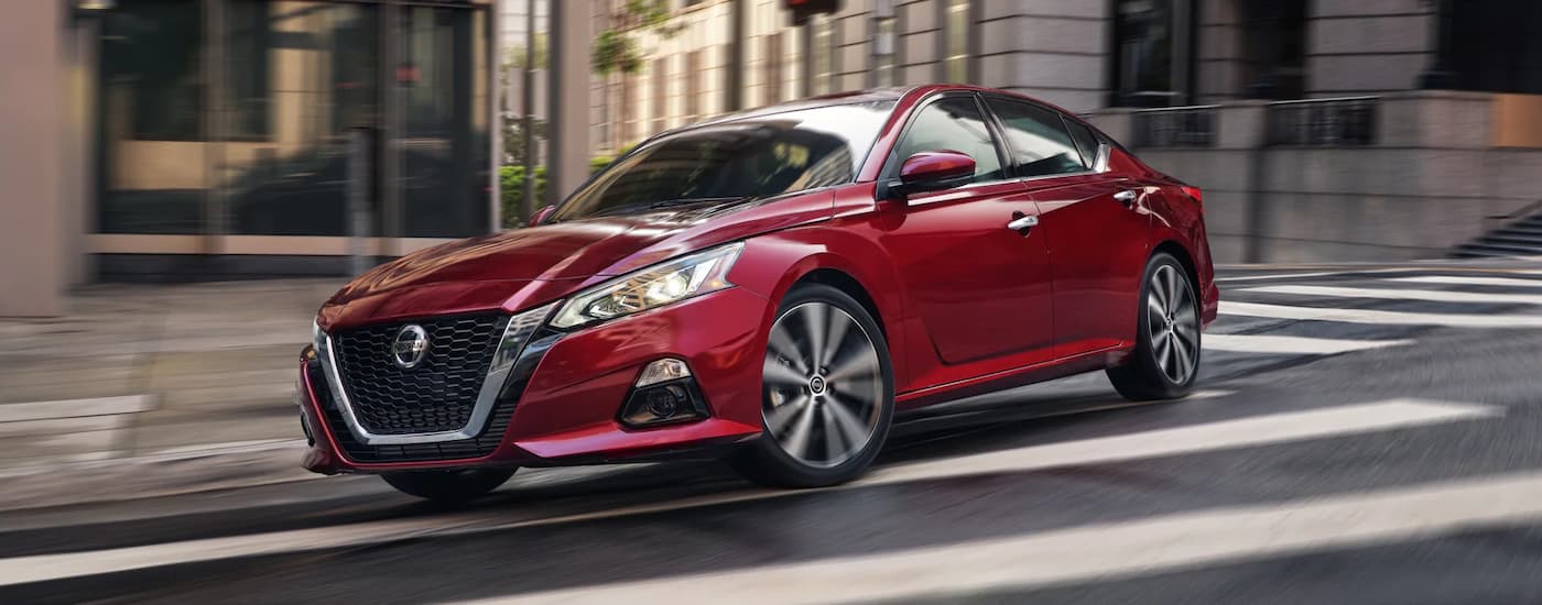 Used%20Car%20Dealer%20Near%20Ocean%20Springs%20-%202022%20Nissan%20Altima%20-%20Red%20Turning.jpg Red 2022 Nissan Altima leaving a used car dealer near Ocean Springs