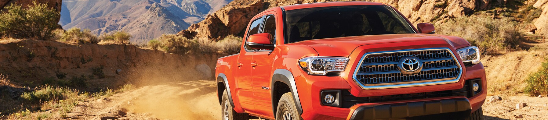 Toyota truck driving on dirt road image