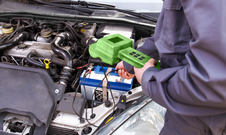 Technician checking battery