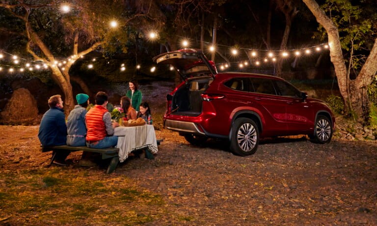 Family having a picnic in the woods with 2020 Toyota Highlander