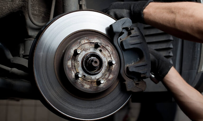 Mechanic changing brake pads