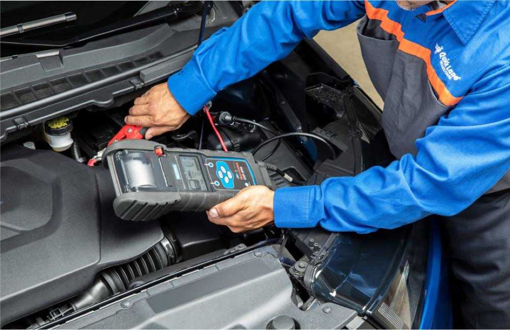 quick-lane-technician-checking-vehicle-battery-hero-d.jpg