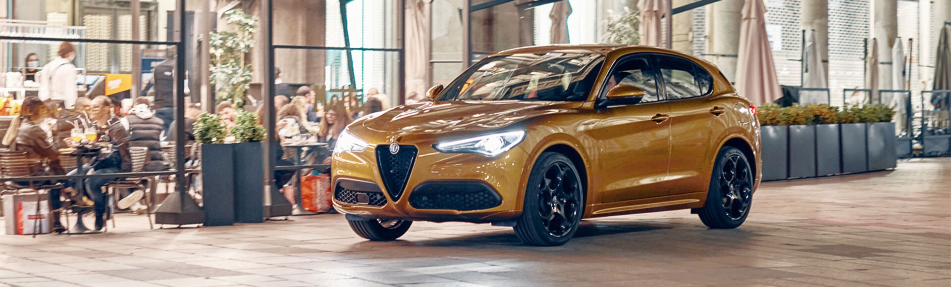 Alfa Romeo Stelvio parked in front of restaurant.