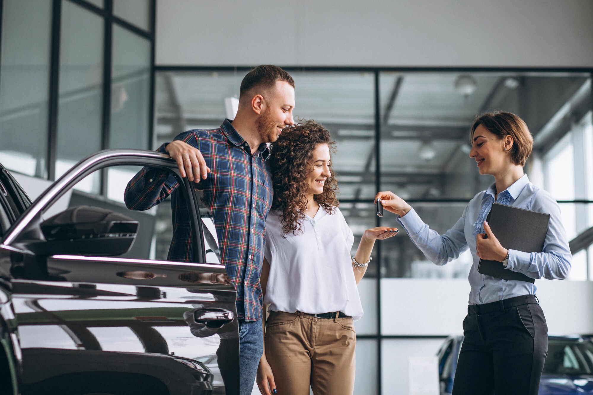 young-couple-choosing-car-car-show-room.jpg