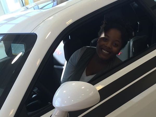nadia taking a break in a 2014 dodge challenger.jpg