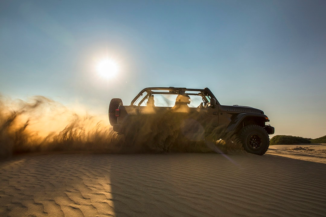 side view of the 2021 Jeep Wrangler 392 on a sand dune