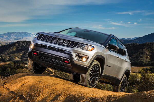 2020-jeep-compass-capability-feature-grey-parked-hill-moutains.jpg