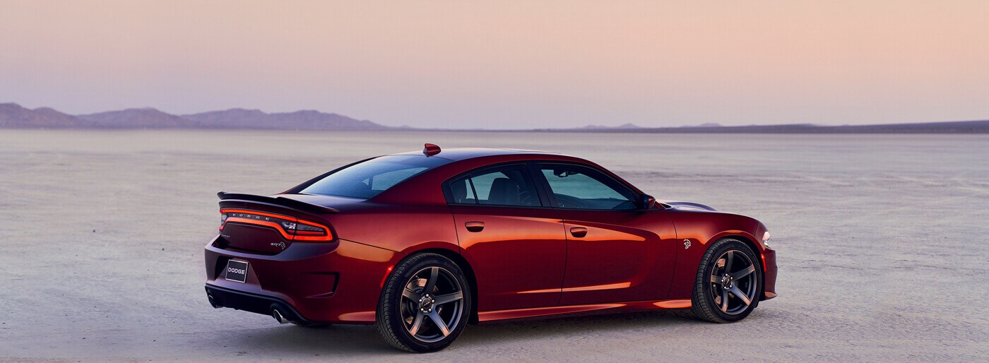 2019-dodge-charger-red-exterior_e07d947c37625befa1d20fb19da1c4be-desktopRetina-1400x514 (1).jpg
