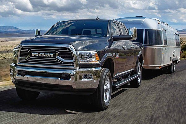 Heavy Duty Truck Towing Silver Trailer.jpg