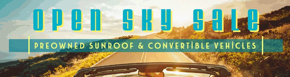 Convertible_car_sunroof_vehicle_sale_with_convertible_driving on road_in_summer_sun.gif