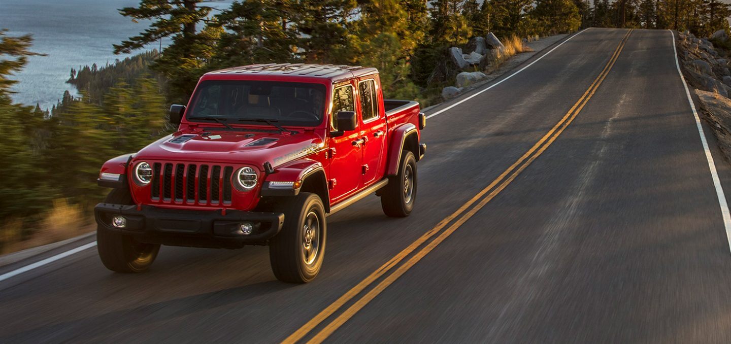2021 Red Jeep Gladiator Driving On Road 2021 Red Jeep Gladiator Driving On Road